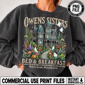 May include: A charcoal gray crewneck sweatshirt featuring a graphic of a Victorian mansion with the text OWENS SISTERS BED & BREAKFAST, Chocolate Cake for Breakfast & Midnight Margaritas Served Daily, Maria's Island, Massachusetts.