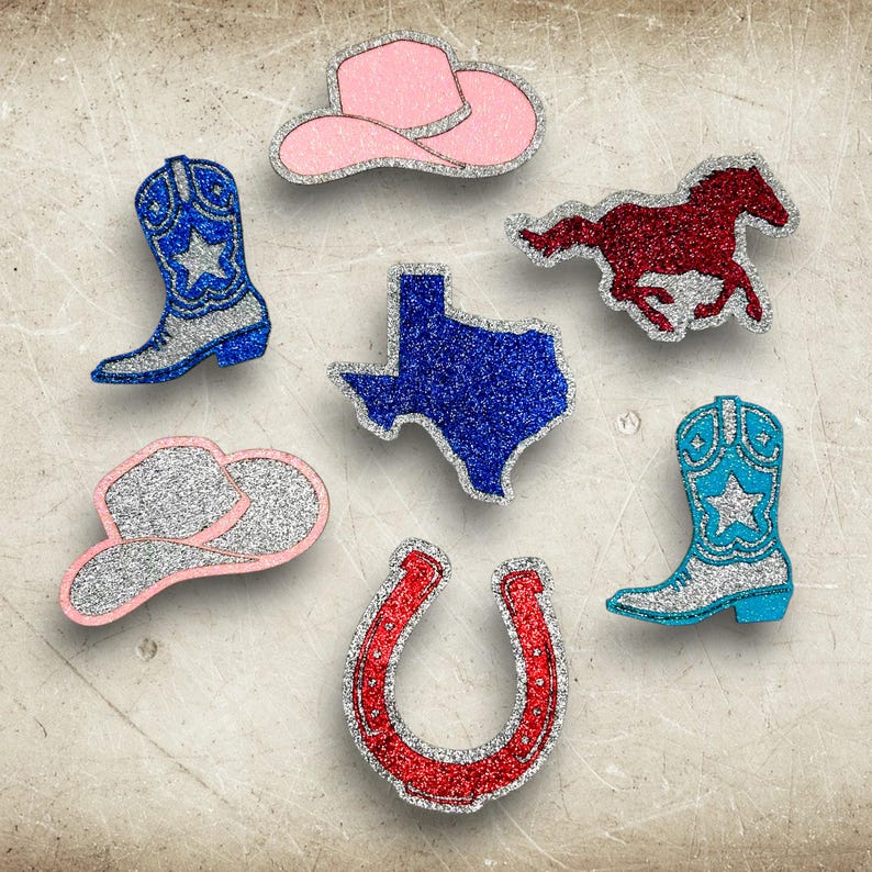 May include: A collection of glittery Western-themed embellishments. Includes a pink cowboy hat, a blue cowboy boot with a star, a red running horse, a blue Texas outline, a silver and pink cowboy hat, a red horseshoe, and a turquoise cowboy boot.