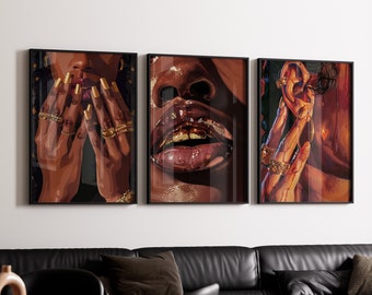 May include: Three framed art prints featuring close-up portraits of a person with dark skin. The first print shows the person's hands with gold rings and long, gold-painted nails. The second print shows the person's mouth with gold teeth and glossy lips. The third print shows the person's ear with a gold earring and a hand touching the ear.