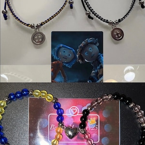 May include: Two sets of friendship bracelets with button charms. One set is blue and yellow, the other is black and gray. The bracelets are displayed with a photo of the characters from the movie "Coraline".