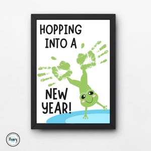 May include: A green frog with handprint arms is hopping into a new year. The text "Hopping into a New Year!" is written in black on a white background.
