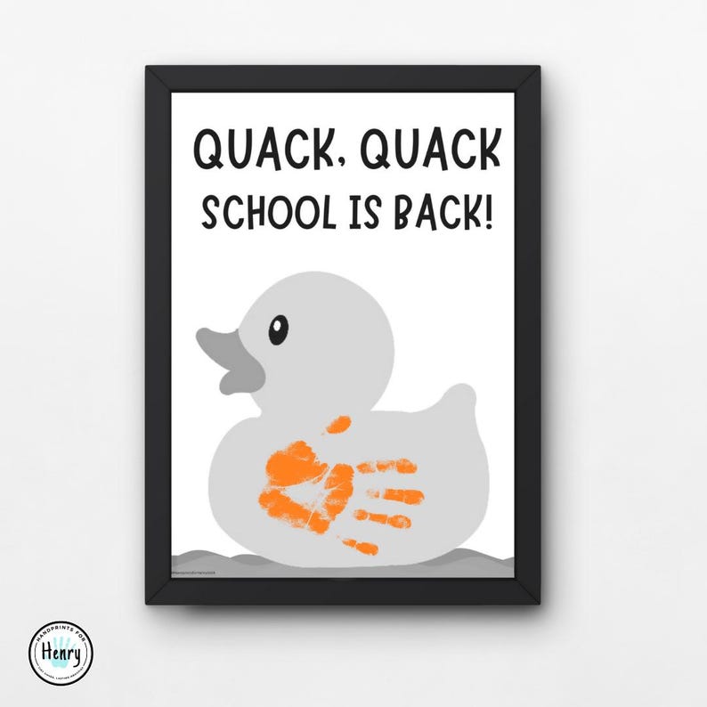 May include: Framed print featuring a gray duck with an orange handprint and the text "QUACK. QUACK SCHOOL IS BACK!". The duck is set against a white background, with a black frame. A fun, back-to-school themed art print.