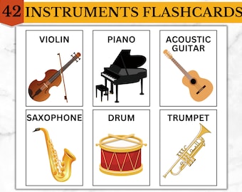 Op de afbeelding: Een set van zes flashcards met illustraties van muziekinstrumenten. De instrumenten omvatten een viool, een piano, een akoestische gitaar, een saxofoon, een drum en een trompet. De flashcards zijn wit met zwarte randen en de namen van de instrumenten zijn in zwart gedrukt.