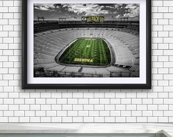 May include: Framed black and white photograph of a football stadium with a green field. The words "GO PACK GO" are visible above the stadium. The word "PACKERS" is written in yellow on the field.