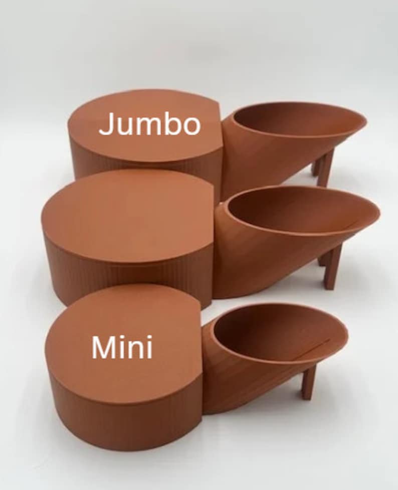 May include: Three terracotta-colored ceramic planters, labeled "Jumbo", "Mini", and "Mini". The planters are in the shape of a cylinder and a curved spout.