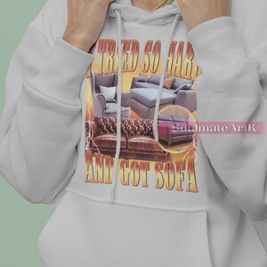 May include: A gray hoodie with a graphic print of a couch and the text "I tried so hard and got sofa".