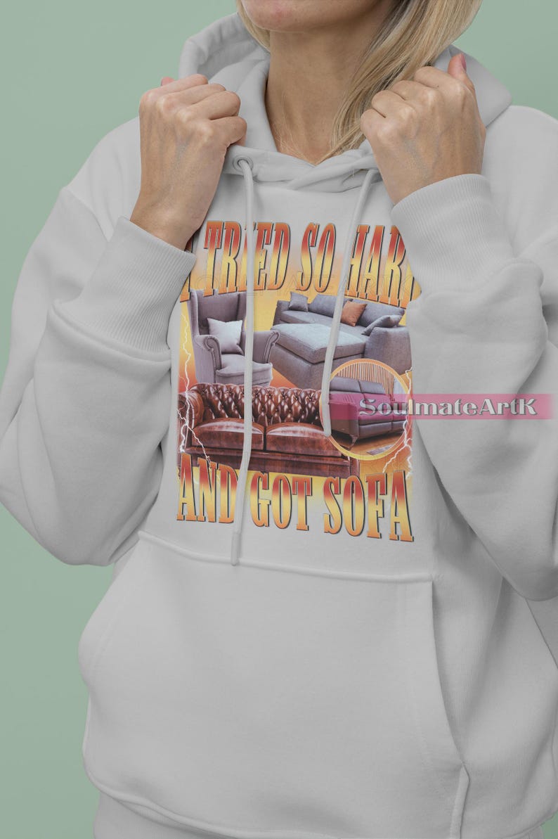 May include: A gray hoodie with a graphic print of a couch and the text "I tried so hard and got sofa".