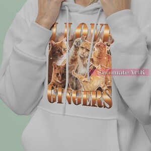 May include: A white hoodie with a graphic print of orange tabby cats and the text "I LOVE GINGERS".