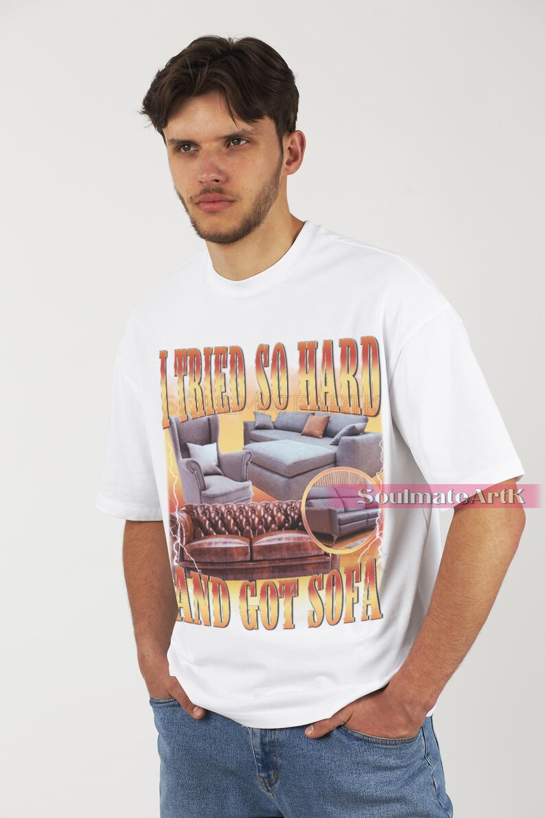 May include: White t-shirt with a graphic print of three sofas and the text "I tried so hard and got sofa".