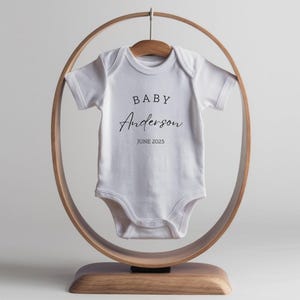 Pregnancy Announcement Baby Bodysuit - Newborn Baby Outfit Brand - Baby Announcement Bodysuit - Personalized Last Name - Baby Shower Décor White