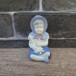 Vintage Girl Figurine Holding Baby Doll
