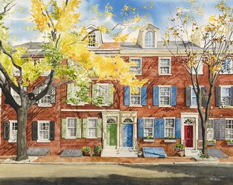 May include: A watercolor painting of a row of brick houses with green, blue, and red doors. The houses have windows with white shutters and are surrounded by trees with yellow leaves.