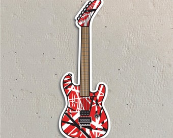 Może przedstawiać: Czerwono-biało-czarna gitara elektryczna z paskowanym wzorem. Gitara ma czarny pickguard i biały gałkę.