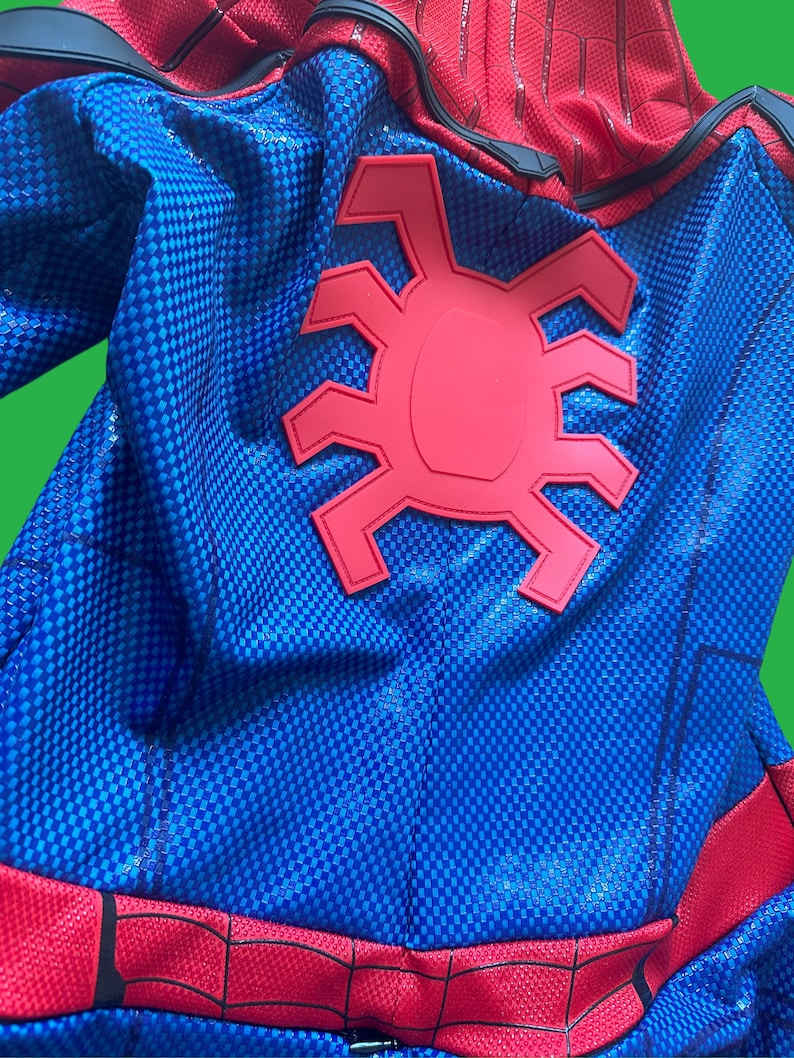 May include: Blue and red Spiderman costume with a large red spider logo on the back. The costume has a textured fabric.