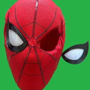 May include: Red and black Spider-Man mask with a white mesh eye piece. The mask is made of fabric and has a textured surface.
