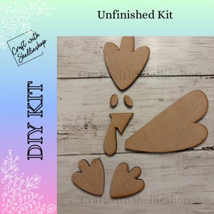 May include: A DIY kit with unfinished wooden pieces, including a large heart-shaped body, two feet, two eyes, a beak, and a head. The kit is labeled "Unfinished Kit" and "DIY KIT" in the image.