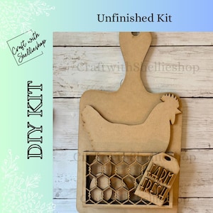 May include: Unfinished DIY kit featuring a wooden cutting board shape with a hen and egg basket design. The kit includes a tag that reads "Farm Fresh". The words "DIY KIT" and "Unfinished Kit" are also visible.
