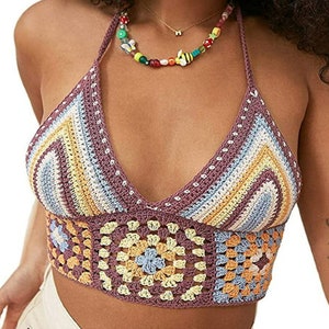 May include: A crocheted halter top with a multi-colored striped pattern and a granny square design. The top is made of a soft, lightweight yarn and has a relaxed fit.