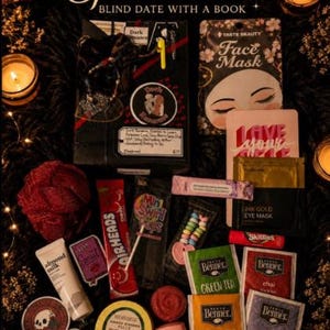 May include: A Spa Deluxe Blind Date with a Book gift set containing a wrapped book, a Taste Beauty face mask, 24K gold eye masks, Bigelow tea bags, Airheads candy, Mint Swirl Pops, Skittles, almond milk lotion, a red bath sponge, and various stickers.