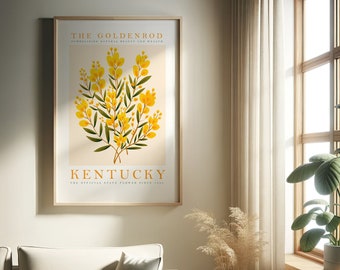 May include: A framed print with a botanical illustration of goldenrod flowers, the official state flower of Kentucky. The text "THE GOLDENROD" and "KENTUCKY" is printed in a brown font. The text "SYMBOLIZING NATURAL BEAUTY AND HEALTH" and "THE OFFICIAL STATE FLOWER SINCE 1926" is printed in a smaller brown font.