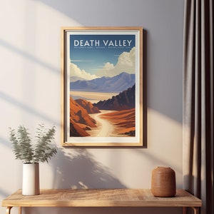 May include: A vintage-style poster with a scenic view of Death Valley National Park in California. The poster features a colorful illustration of a winding road through a desert landscape with mountains in the background. The text "DEATH VALLEY NATIONAL PARK - NEVADA - ESTABLISHED 1994" is printed at the top of the poster.