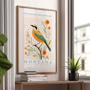 May include: A vintage-style poster featuring a yellow and green Western Meadowlark bird perched on a branch with orange flowers. The poster reads "The Western Meadowlark, symbolizing peace and protection. Montana, the official state bird since 1931."