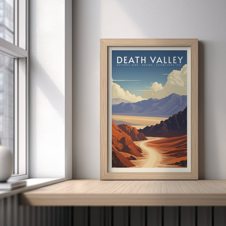 May include: A vintage-style poster with a brown wooden frame featuring a scenic view of Death Valley National Park in California. The poster has the text "Death Valley National Park, Nevada, Established 1934" at the top.