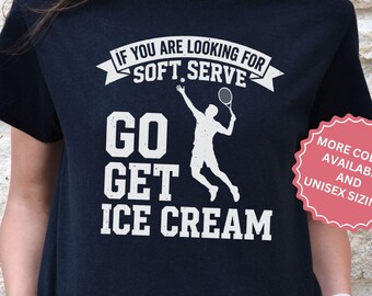 May include: Black t-shirt with white text and a tennis graphic. The text says "IF YOU ARE LOOKING FOR SOFT SERVE, GO GET ICE CREAM." A pink sticker indicates more colours and unisex sizing are available.