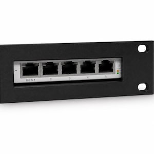 May include: A black network switch with five Ethernet ports labeled 2, 3, 4, and 5. The switch has a silver faceplate and the text "PoE IN 4" is visible. Two mounting holes are on the right side.