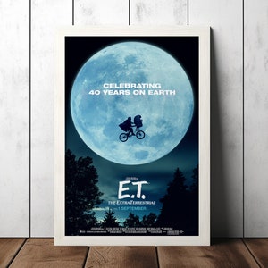 May include: A movie poster for the film E.T. the Extra-Terrestrial, celebrating 40 years on Earth. The poster features a blue moon with a silhouette of E.T. flying on his bicycle. The text "Celebrating 40 Years on Earth" is at the top of the poster, and the title "E.T. The Extra-Terrestrial" is at the bottom, along with the release date "1 September".