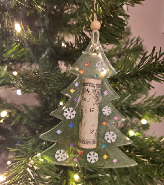 Cash holding Christmas ornaments