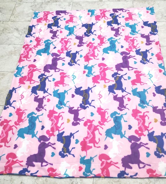 Colorful carousel unicorn and heart double layered fleece throw blanket.