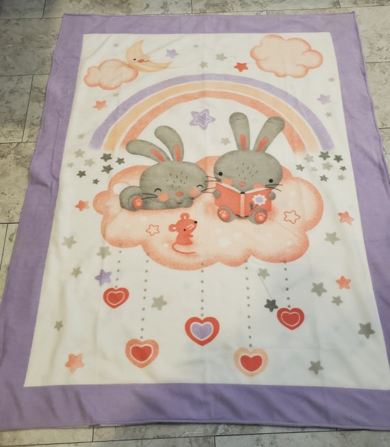 Bunnies snuggling on a cloud double layered fleece throw blanket