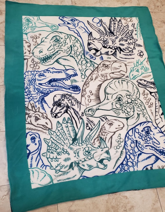 Double layered reversible fleece dinosaur throw blanket