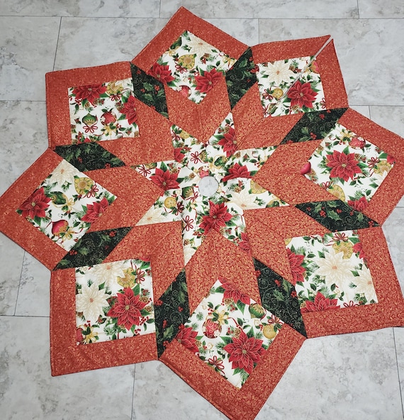 Traditional poinsettia and decorative ornament quilted Christmas tree skirt