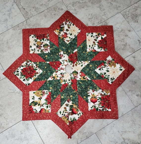 Small elegant, tabletop, decorative ornament and poinsettia quilted Christmas tree skirt