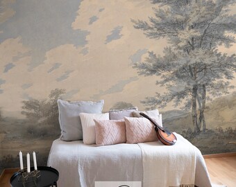 Può includere: Un murale ad acquerello blu chiaro e beige che rappresenta un paesaggio con un grande albero e un cielo nuvoloso. Il murale è esposto in una camera da letto con un letto bianco, cuscini e una coperta.