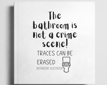 May include: White bathroom guest book with the text "The bathroom is not a crime scene! Traces can be erased" and a black and white illustration of a toilet.