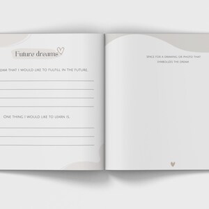 May include: Open journal with the words "Future dreams" and prompts to write about future goals and dreams. The left page has prompts for a big dream and something to learn. The right page is blank for a drawing or photo.