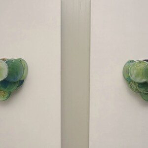 Pair of glass wall sconces - 10 iridescent alabaster green discs