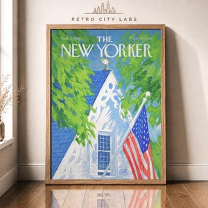 May include: A framed print of a July 2, 1966 New Yorker magazine cover featuring a painting of a white house with a blue roof, green trees, and an American flag on a pole. The text reads The New Yorker, July 2, 1966, and Price 35 cents.