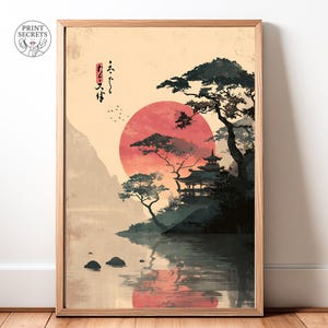 Può includere: Stampa artistica incorniciata raffigurante un paesaggio giapponese con un sole rosso, alberi e una pagoda riflessa nell'acqua. L'opera d'arte ha un'estetica vintage con una cornice in legno marrone chiaro.