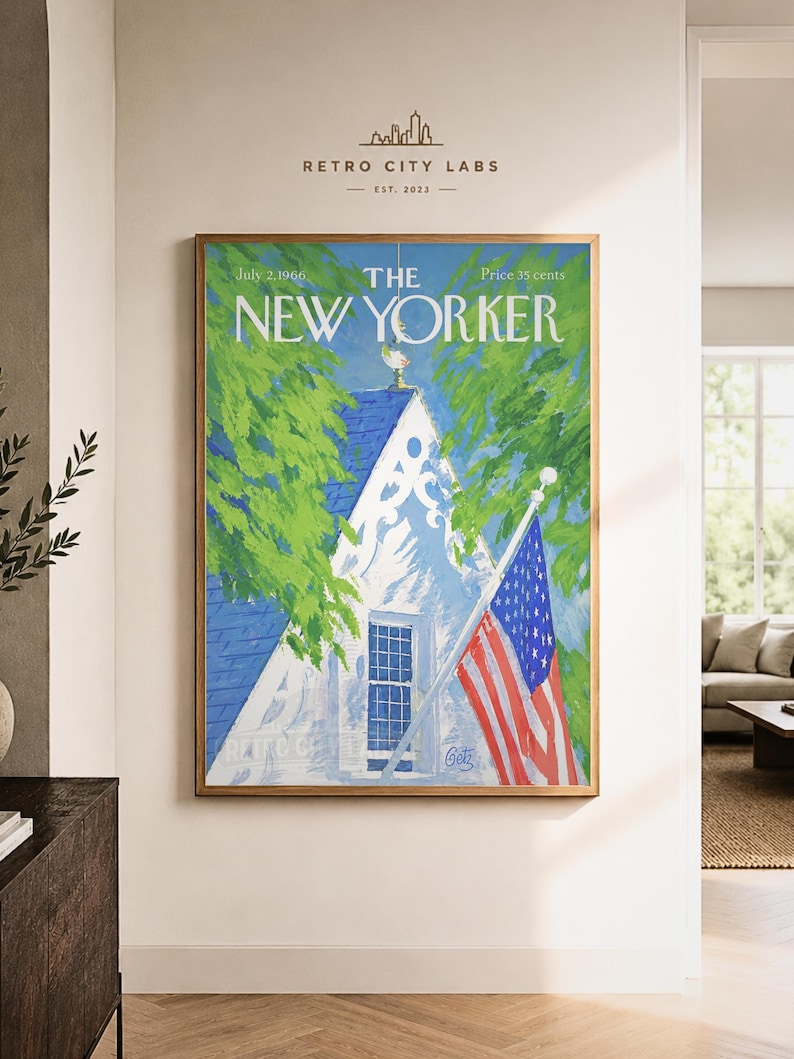 May include: A framed wall art print of The New Yorker magazine cover dated July 2, 1966. The illustration features a white house with a blue roof, green trees, and an American flag on a pole. The text reads The New Yorker, July 2, 1966, 35 cents.