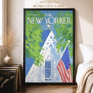 May include: A framed wall art print of The New Yorker magazine cover dated July 2, 1966. The illustration features a white house with a blue roof, green trees, and an American flag. The text reads The New Yorker, July 2, 1966, and Price 35 cents.