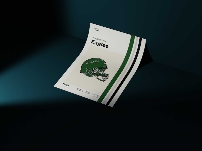 May include: A minimalist poster with a green and white color scheme featuring the Philadelphia Eagles logo. The logo is a green football helmet with the word "Eagles" written on the side. The poster has the text "Philadelphia/Eagles" at the top and the number "19X3" at the bottom.
