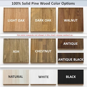 May include: A chart of 100% solid pine wood colour options. The image presents a range of wood tones: Light Oak, Dark Oak, Walnut, Ash, Chestnut, Antique, Antique Black, Natural, White, and Black. Text: "For colour requests not shown in the chart, please contact us."