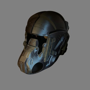 May include: A futuristic helmet with a black and gold design. The helmet has a visor and a face mask.