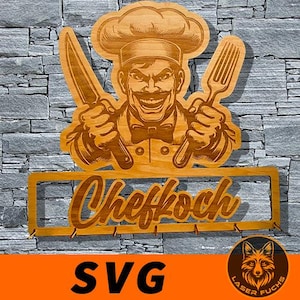 May include: Wooden kitchen sign featuring a chef holding a knife and spatula, with the word "Chefkoch" below. The sign has a rectangular frame with hooks. The image includes the text "SVG" and a logo.