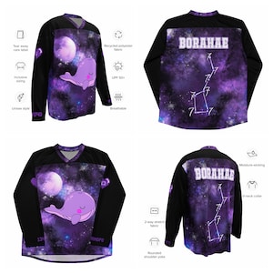Op de afbeelding: Zwart shirt met lange mouwen met een paars galaxy-ontwerp, een cartoonwalvis en het woord "BORAHAE". Het shirt heeft een V-hals en is gemaakt van ademende, vochtafvoerende stof. Kenmerken zijn een afscheurbaar waslabel en inclusieve maten.