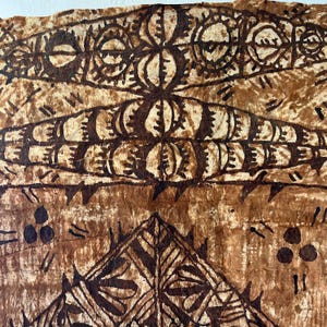 May include: A piece of textured, fibrous bark cloth featuring dark brown ink patterns. The design includes horizontal bands of circular motifs, geometric shapes, and triangular elements, accented by small clusters of three dots and short dash marks.